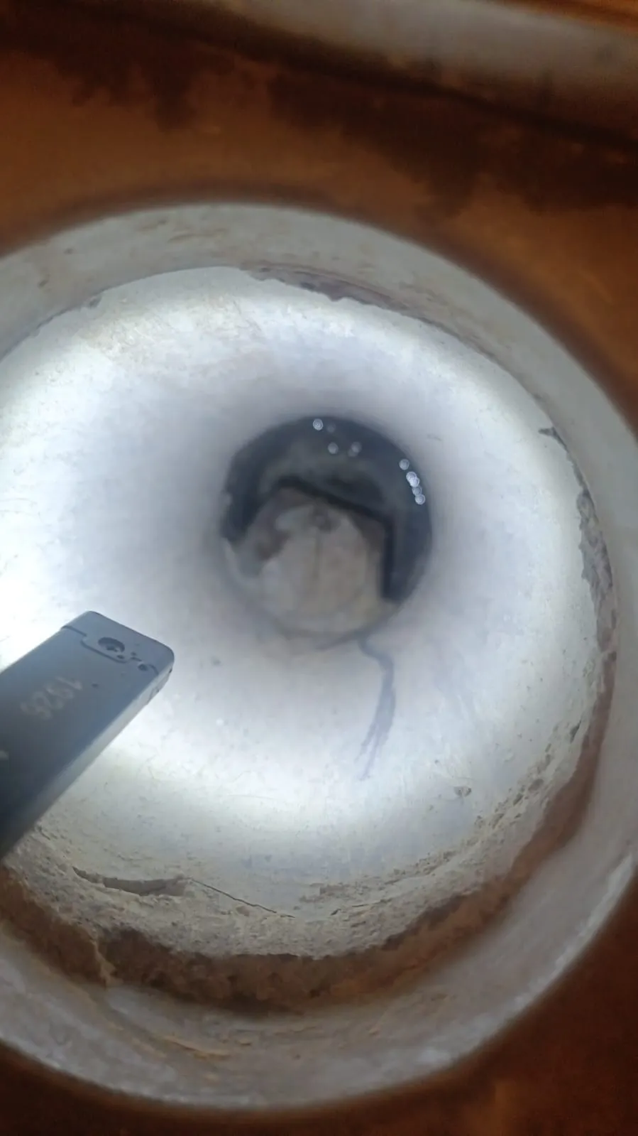Improperly sealed master bathroom drainage connection found during snagging inspection at Arada, Sharjah